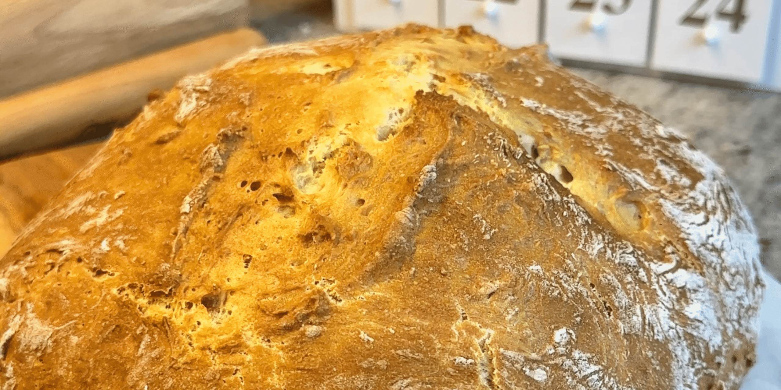 Golden brown Irish soda bread on a kitchen counter