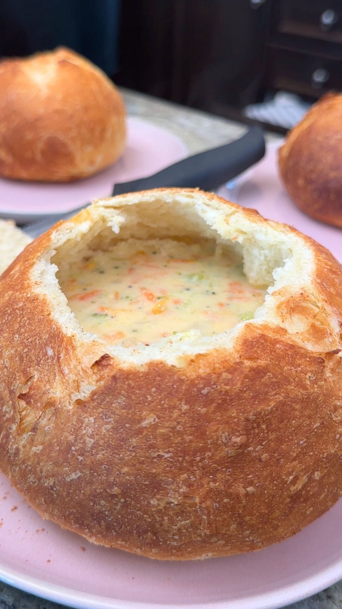 Broccoli cheese soup in a bread bowl, a quick and easy meal.