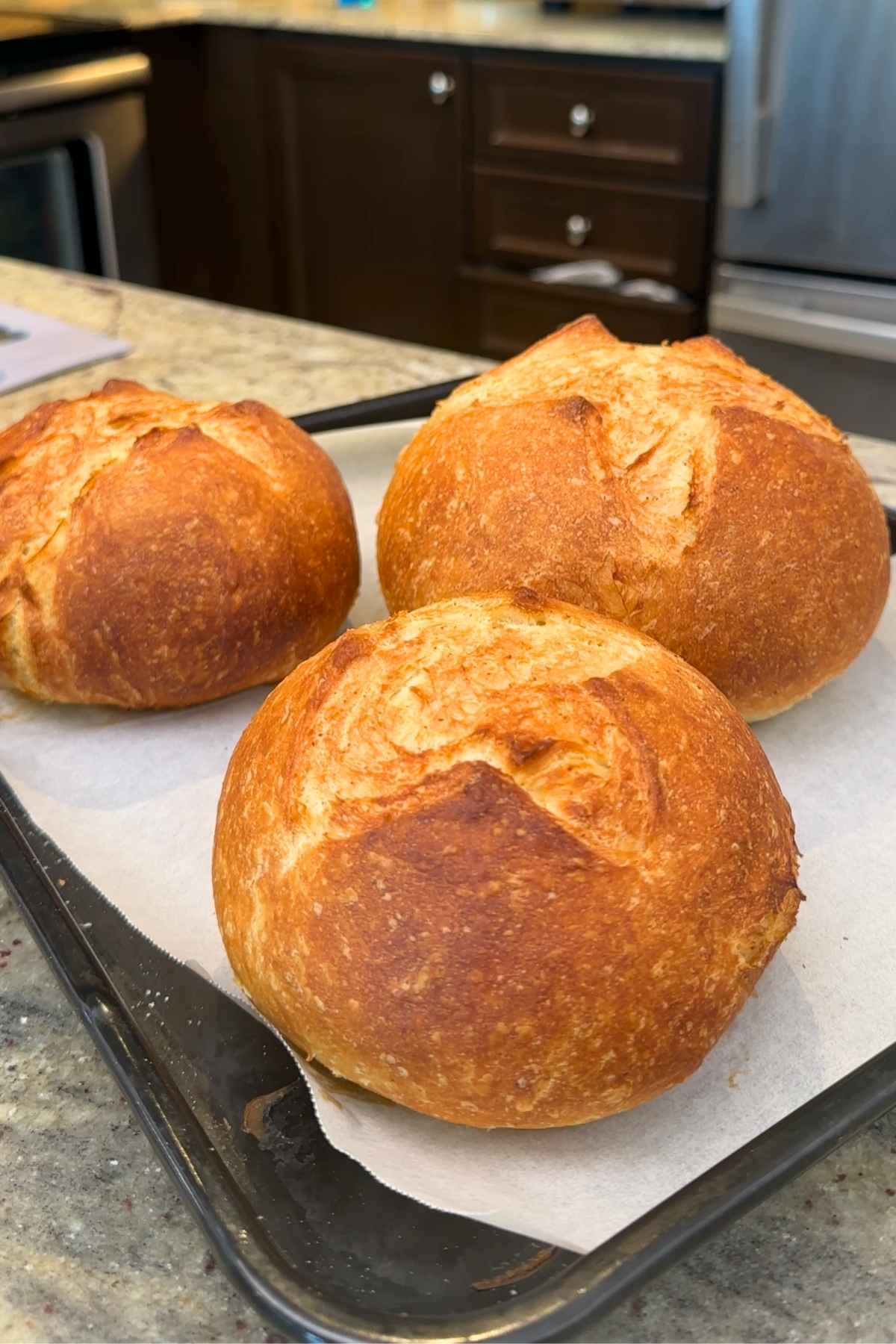 Three golden homemade bread bowls.