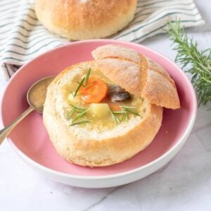 Homemade bread bowl filled with soup.