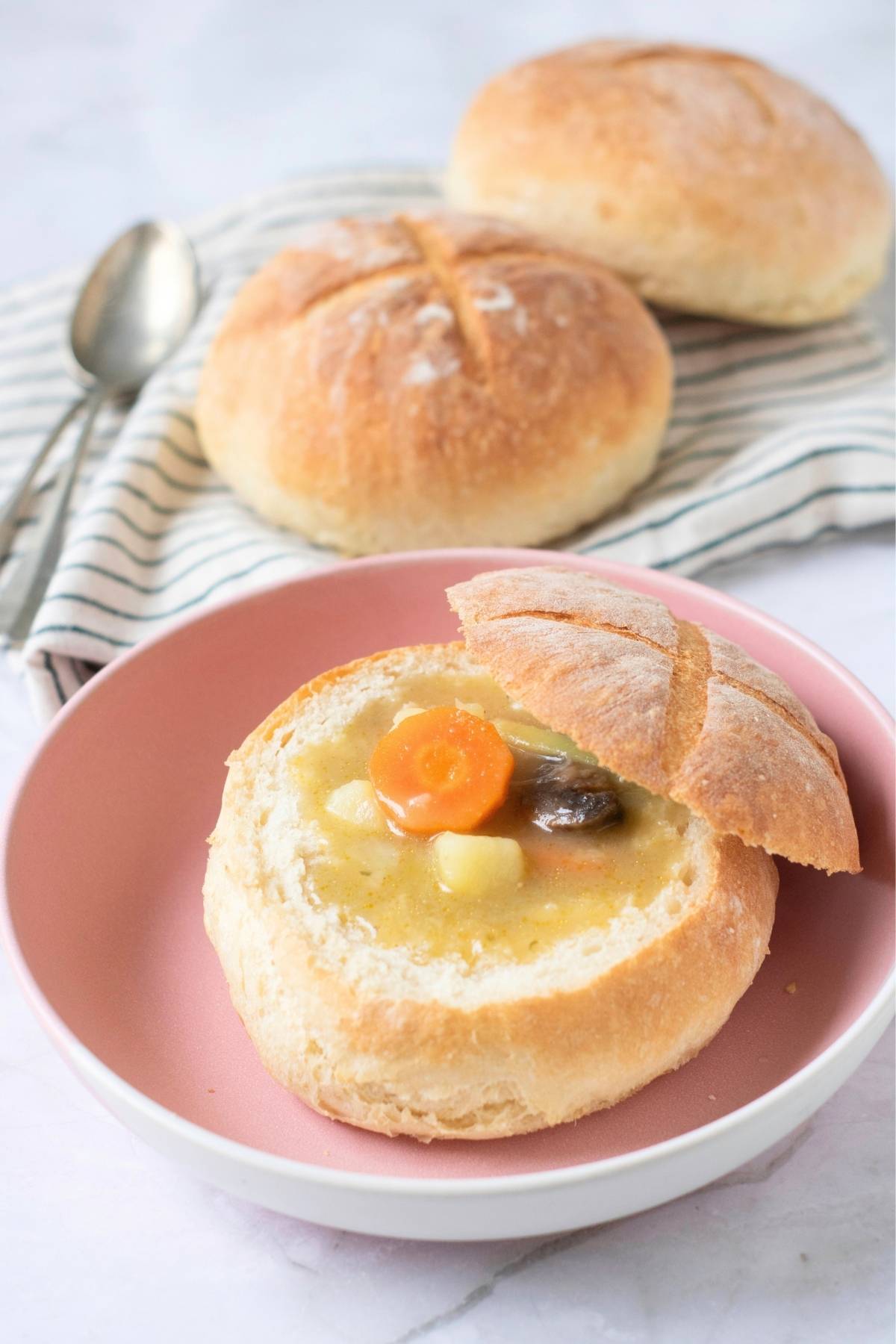 Homemade bread bowl filled with soup.