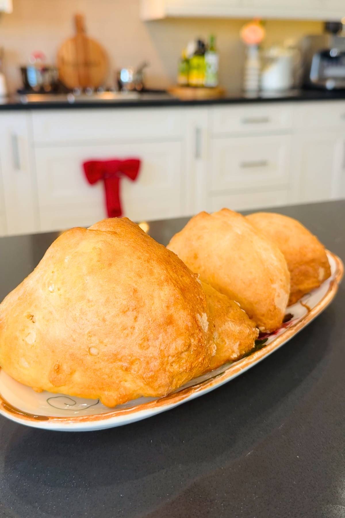 Golden kefir bread loaves on a platter.