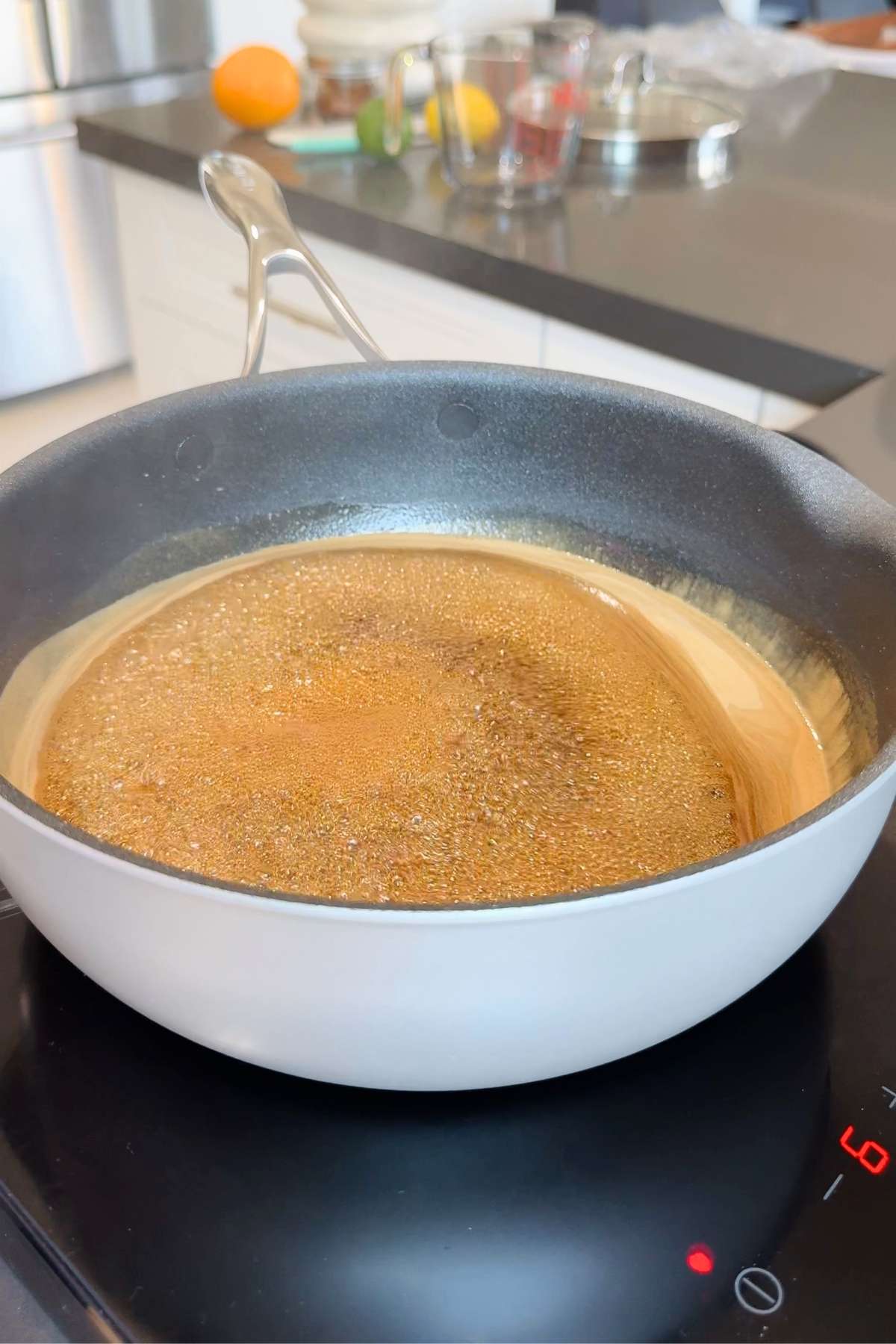 Caramelizing sugar for homemade Coca-Cola recipe.