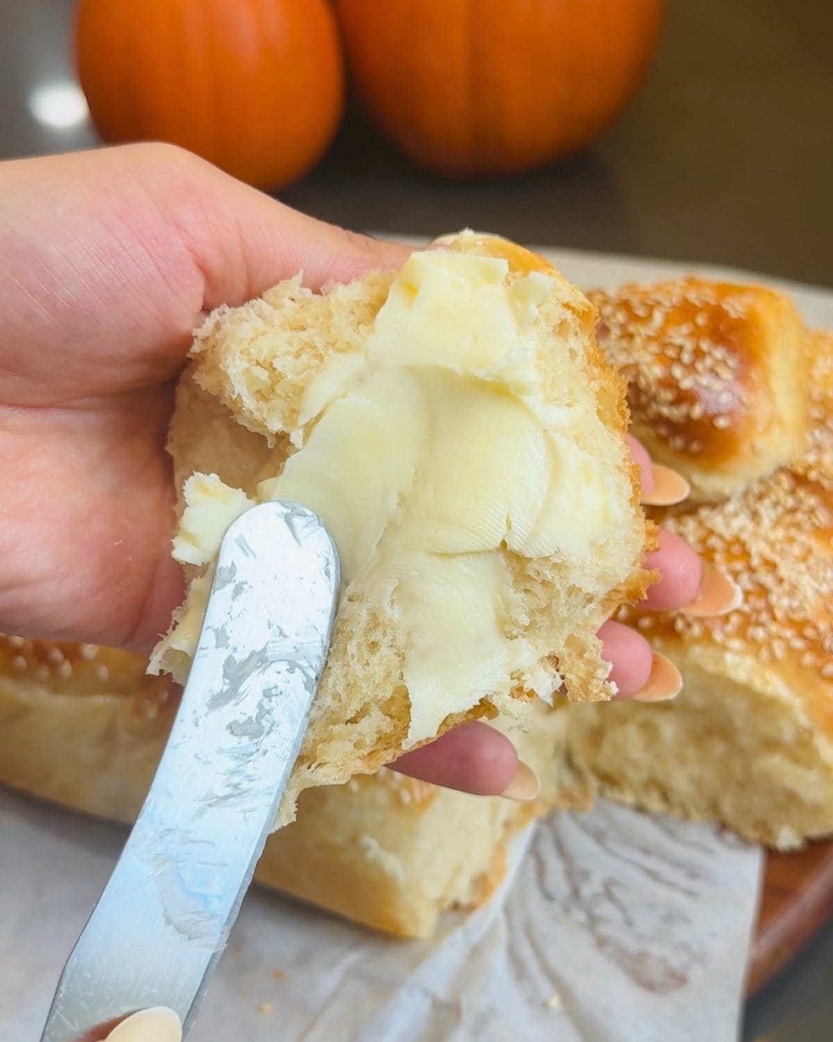 Buttered homemade bread roll. Learn how to make homemade butter in 15 minutes.