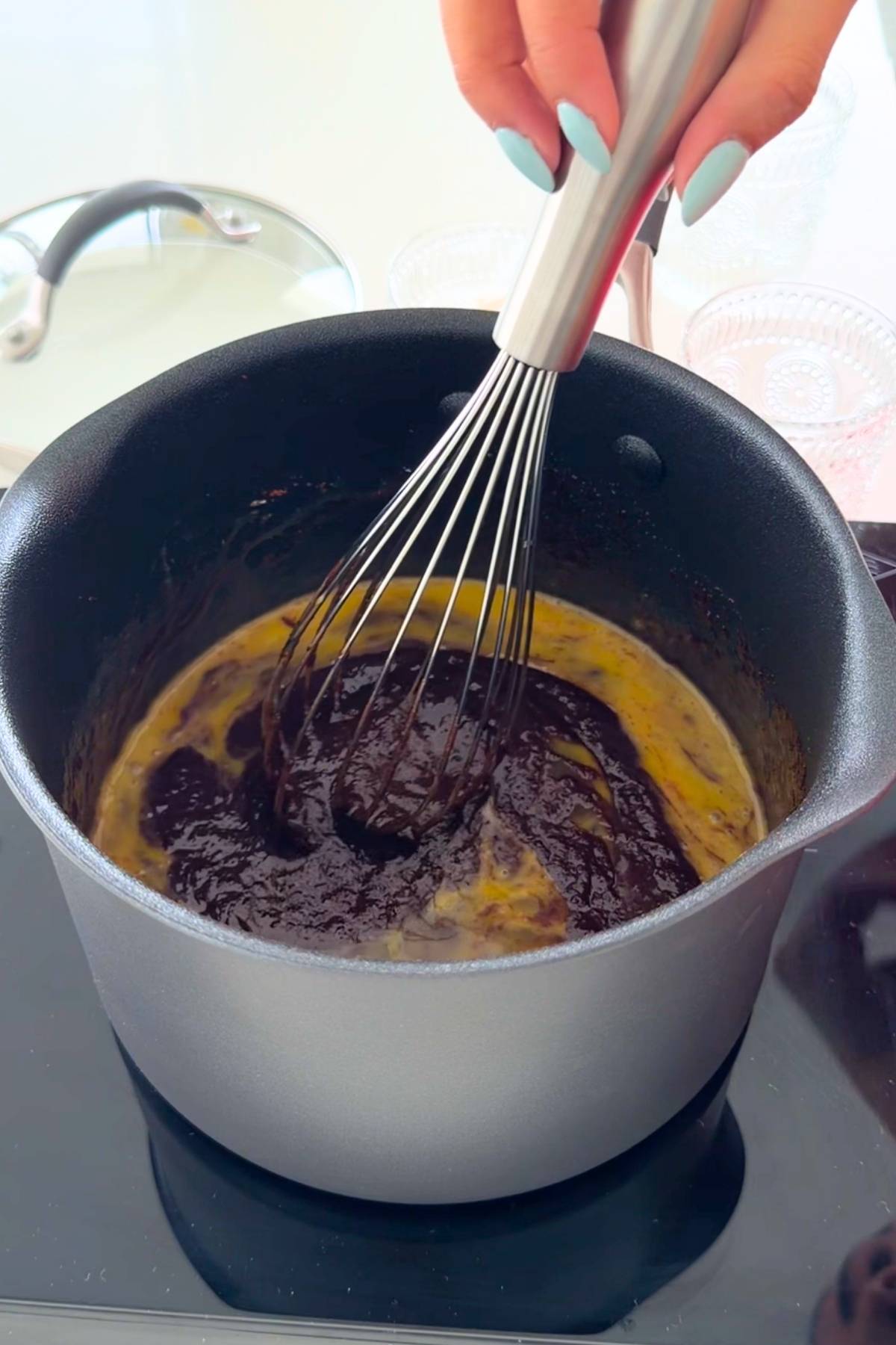 Whisking homemade cosmic brownie batter.