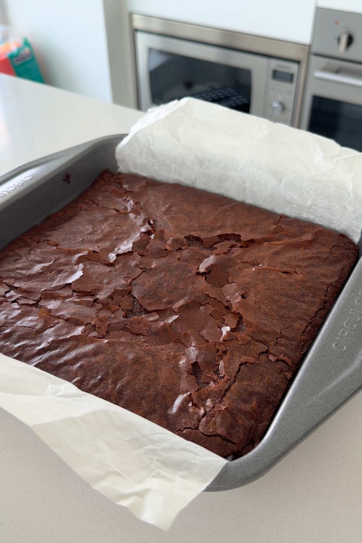 Homemade cosmic brownies in baking pan.