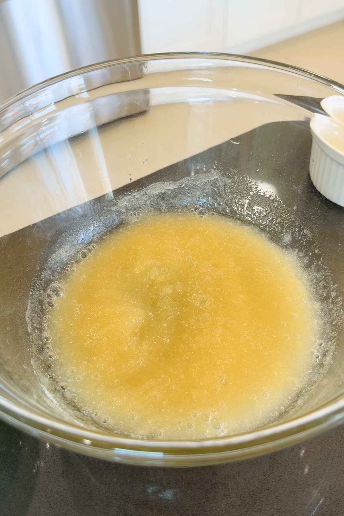 Melted sugar and butter in a bowl.