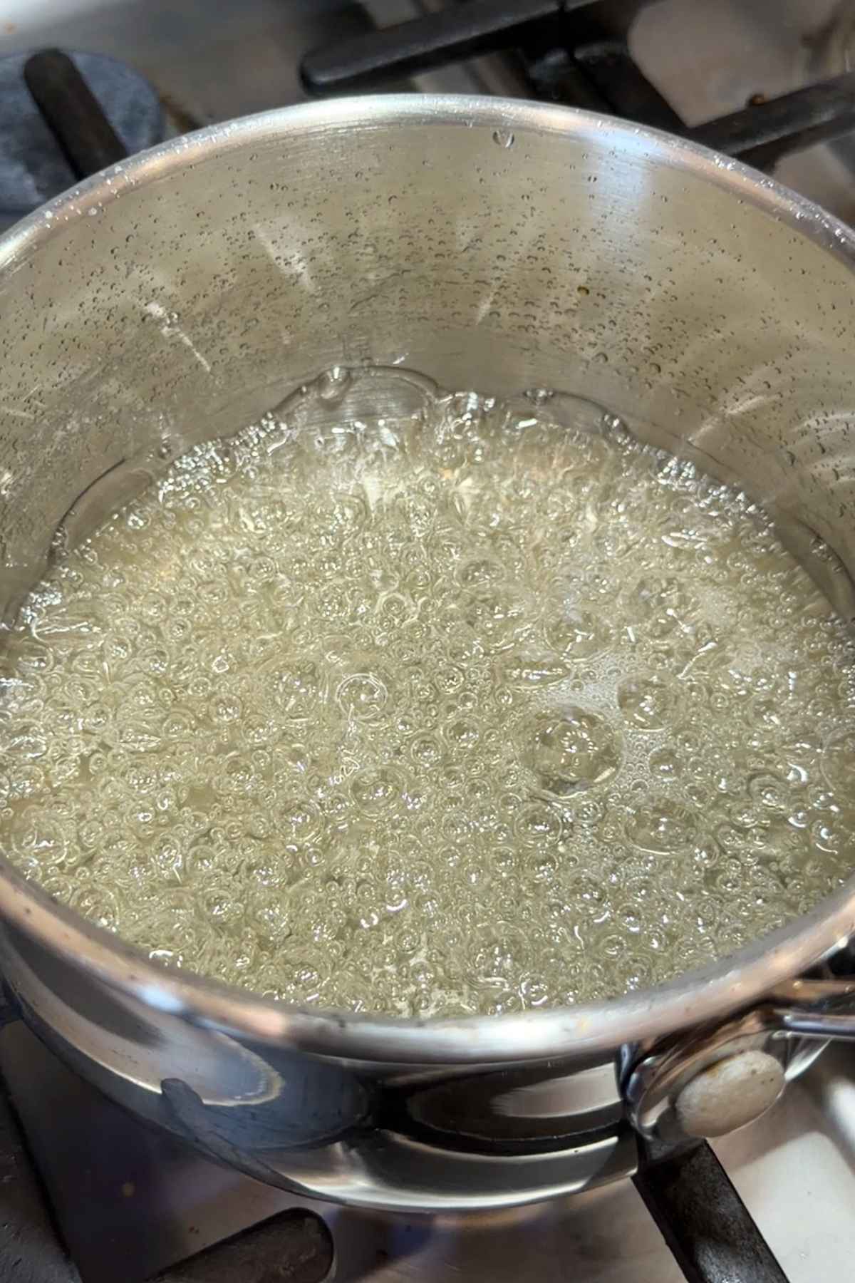 Boiling sugar syrup in a pot for marshmallows.