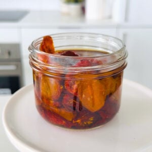 Jar of homemade sundried tomatoes in oil.